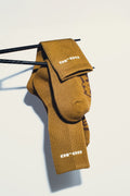 Brown sock with 'ORCA' branding on a light background